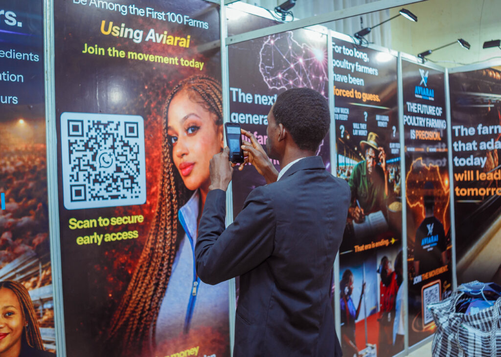 Poultry industry attendee scanning the Aviarai QR code to learn more about the poultry intelligence platform.